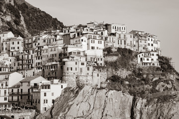 Canvas Print - Sepia toned vintage effect hillside village buildings built on rock cliff face in Cinque Terre on Mediterranean sea