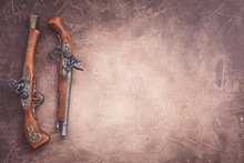 Two Vintage Duel Pistols On Wooden Background