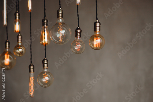 Cuadros en Lienzo Set edison retro lamp on loft gray concrete background
