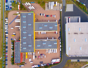 Wall Mural - Aerial view of warehouse with trucks. Industrial background. Logistics from above. 