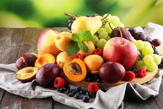 Fresh summer fruits with apple, grapes, berries, pear and apricot