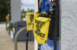 Raleigh, NC/United States- 09/13/2018:  Empty pumps are marked with yellow bags reading 