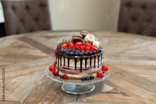 Chocolate And Cream Naked Cake Decorated With Strawberries