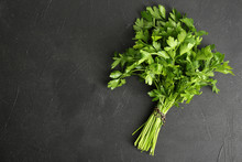 Fresh Green Parsley And Space For Text On Black Background, Top View