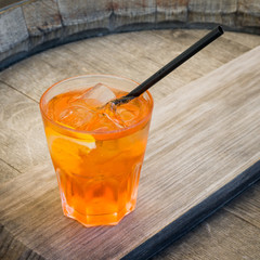 Wall Mural - Alcohol cocktail on wooden table. Top view.