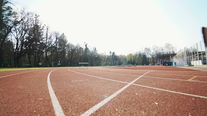 Sticker - Athletic woman running on track. Track runner putting his hands at starting line. Healthy fitness lifestyle.