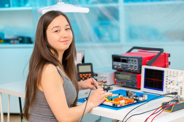 Poster - Girl in robotics laboratory.