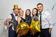 © Syda Productions - celebration, fun and holidays concept - happy friends with golden party props and confetti laughing