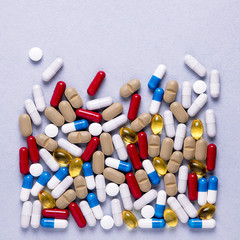 Pharmaceutical preparations, background. Colorful medications Pills, tablets and capsules are scattered. Medical concept