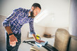 © San4ezz007 - Young bearded man makes cleaning the house