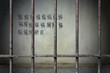 Old prison rusted metal bars cell lock with counting days on wall in the jail, concept of strengthen and protect with wait