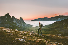 Man Backpacker Hiking In Mountains Alone  Outdoor Active Lifestyle Travel Adventure Vacations Sunset Norway Landscape