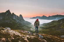 Man Hiking Survival In Mountains Alone Outdoor Active Lifestyle Travel Adventure Extreme Vacations Sunset Norway Landscape