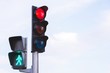 © methaphum - Traffic lights with red light stop car on the road. and green light safe to move  Pedestrian Traffic Lights walk across crosswalk against beautiful blue sky background. soft focus.
