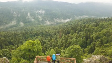 Wall Mural - drone fly over observation deck and tourist people enjoying mountain landscape