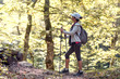 © Novak - Woman Traveler Backpack Enjoying View Forest