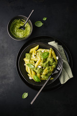 Tasty pasta with pesto served on plate