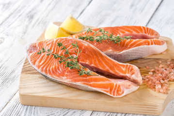 Wall Mural - Raw trout steaks on the wooden board