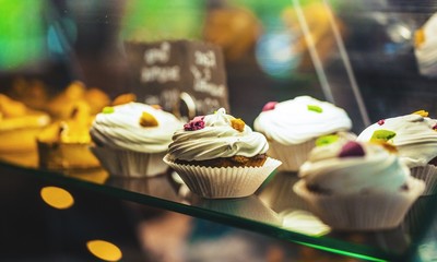 Canvas Print - Tasty Colorful cupcakes on galss desk