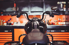 Motorcycles On The Floor With Workshop Tools, A Modern Garage, Storage And Repair. This Bike Will Be Perfect. Repairing A Motorcycle In A Repair Shop