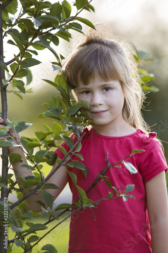 Cute Pretty Child Girl With Gray Eyes And Long Blond Hair Smiling
