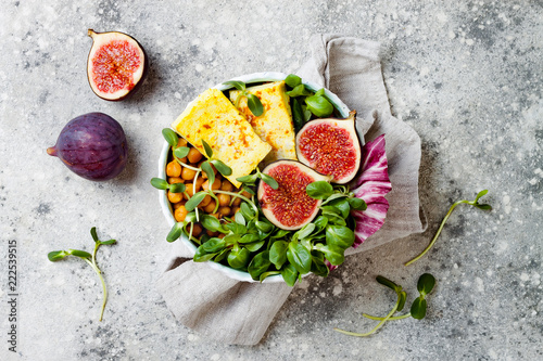 Fotografie, Obraz Vegan, detox Buddha bowl recipe with turmeric roasted tofu, figs, chickpeas and greens