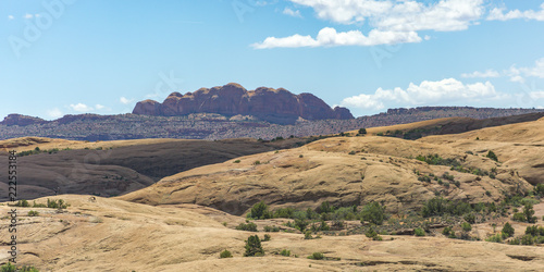 Fotografie, Obraz Off road terrain under sun and clouds in Moab Utah