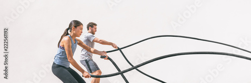 Fotografía Gym fitness sport fit couple working out battle rope exercise banner panorama