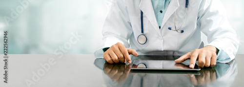 Fotografía Doctor with tablet computer at hospital office.