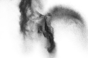 Wall Mural - Black particles splattered on white background. Black powder dust splashing.