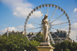 Statue Nymph (Nymphe) dated 1866 by Louis-Auguste Lévêque with ferris wheel on the background in Tuileries Garden (Jardin des Tuileries)