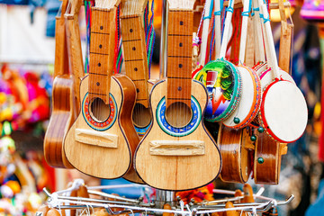 Many Ukuleles for sale on a market