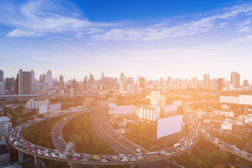 Wall Mural - City highway intersection over business downtown skyline, Bangkok Thailand