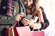 © Kalim - Adult couple shopping in the city during Christmas time