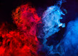 Abstract shapes of red and blue smoke in heart shape at dark background