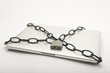 © Александр Овсянников - The laptop is chained with a lock on a white background.
