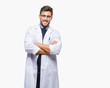 © Krakenimages.com - Young handsome man wearing doctor, scientis coat over isolated background happy face smiling with crossed arms looking at the camera. Positive person.