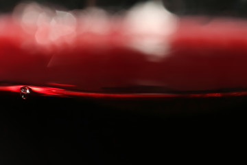 Sticker - Delicious red wine in glass as background, closeup