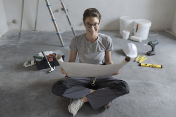 Wall Mural - Woman doing a home makeover in her new house