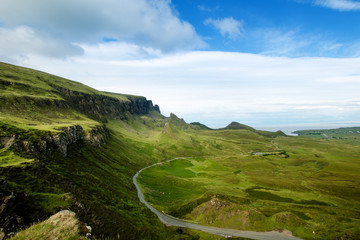 Wall Mural -  Tourists favourite place in Scotland - Isle of Skye. Scotland green nature. Top of the mountains. Beautiful nature. Scottish Highlands. 