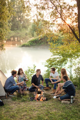 summer holidays with best friends.wonderful scenery with lake on the background of the photo