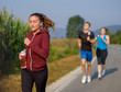 © .shock - young people jogging on country road