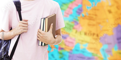 student hand with books and map, learn languages Tableau sur Toile