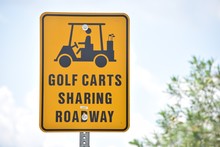 Golf Carts Sharing Road Way