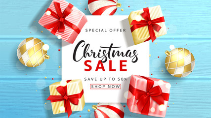 Wall Mural - Beautiful web banner for Christmas sale. Elegant background with top view on realistic gift boxes and Christmas balls on rustic wooden texture. Vector illustration with confetti and effect bokeh.