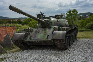 Exposed old tank of war. Big cannon on the military vehicle.