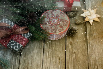 Wall Mural - Christmas background / toy wooden deer ,gifts,star  and cones on the old wooden table