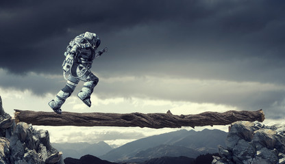 Wall Mural - Spaceman running fast. Mixed media