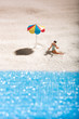 © photology1971 - Young girl sunbathing alone on a sandy beach