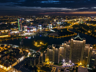 City illumination at midnight. Modern residential and office buildings, aerial top view. Minsk, Belarus